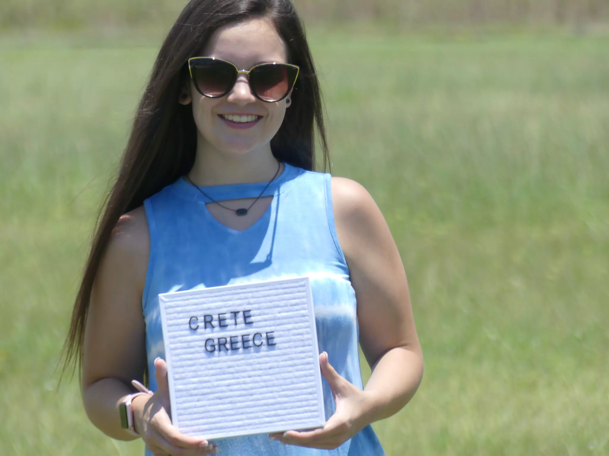 Emily with Crete Sign on Galveston