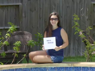 Emily Posing by the Pool in Houstin with Sign in Denim Shorts