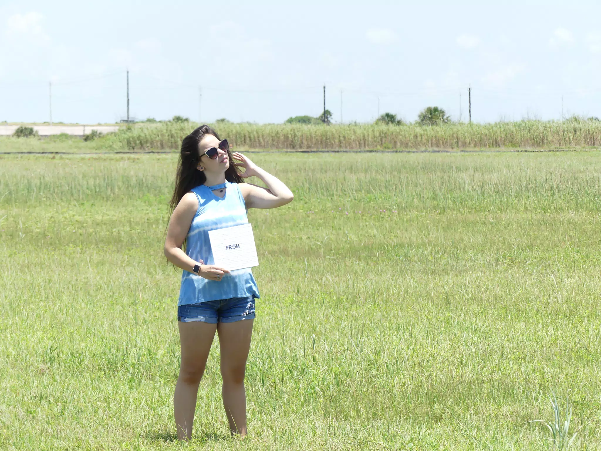 Teen Girl in Field on Modeling Shoot