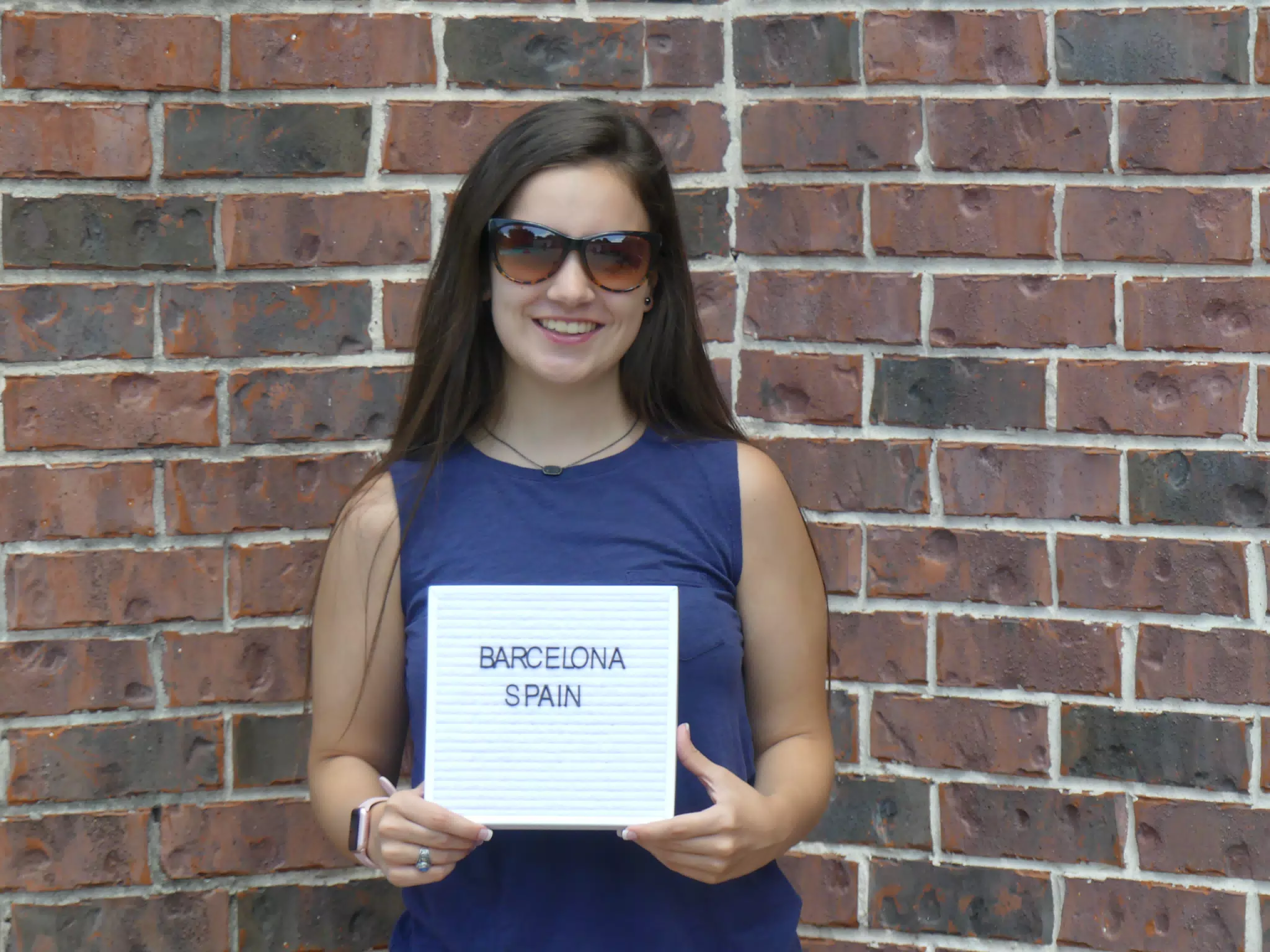 Emily with Sign in Front of Brick Wall, Brunette Teen