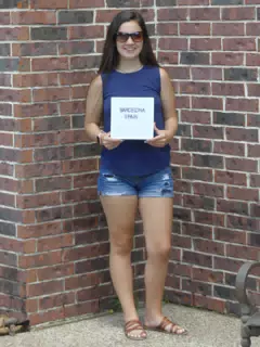Emily Holding Barcelona Sign