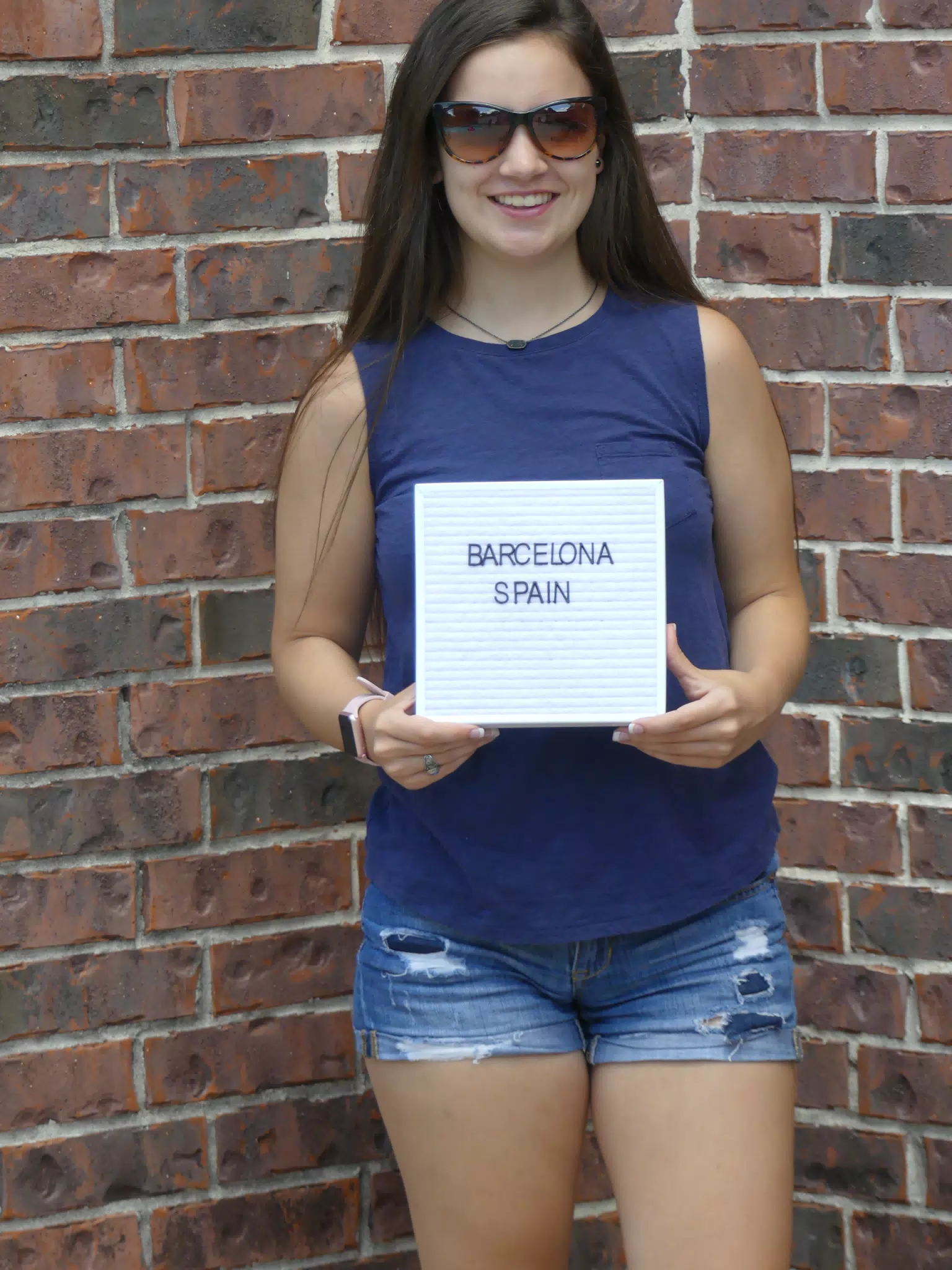 Emily with Barcelona Sign
