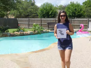 Emily with Important Sign