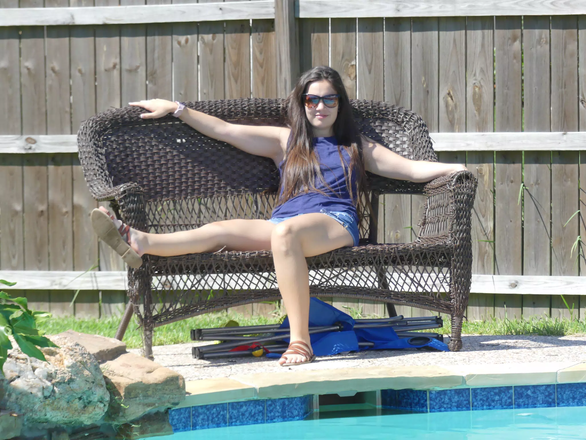 Emily Lounging on Bench by Pool