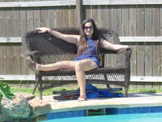 Emily Lounging on Bench by Pool