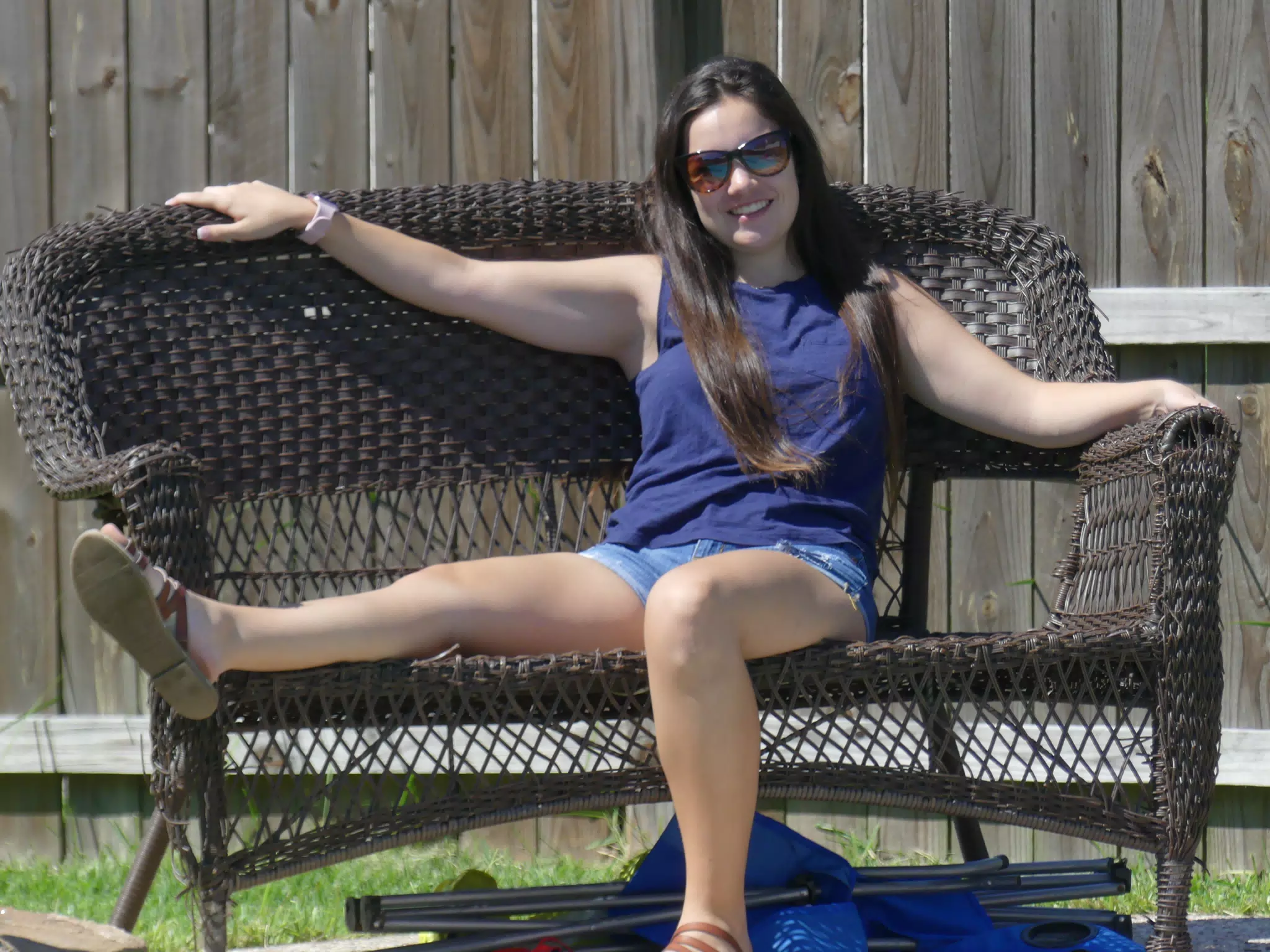 Emily Lounging on Bench Outside