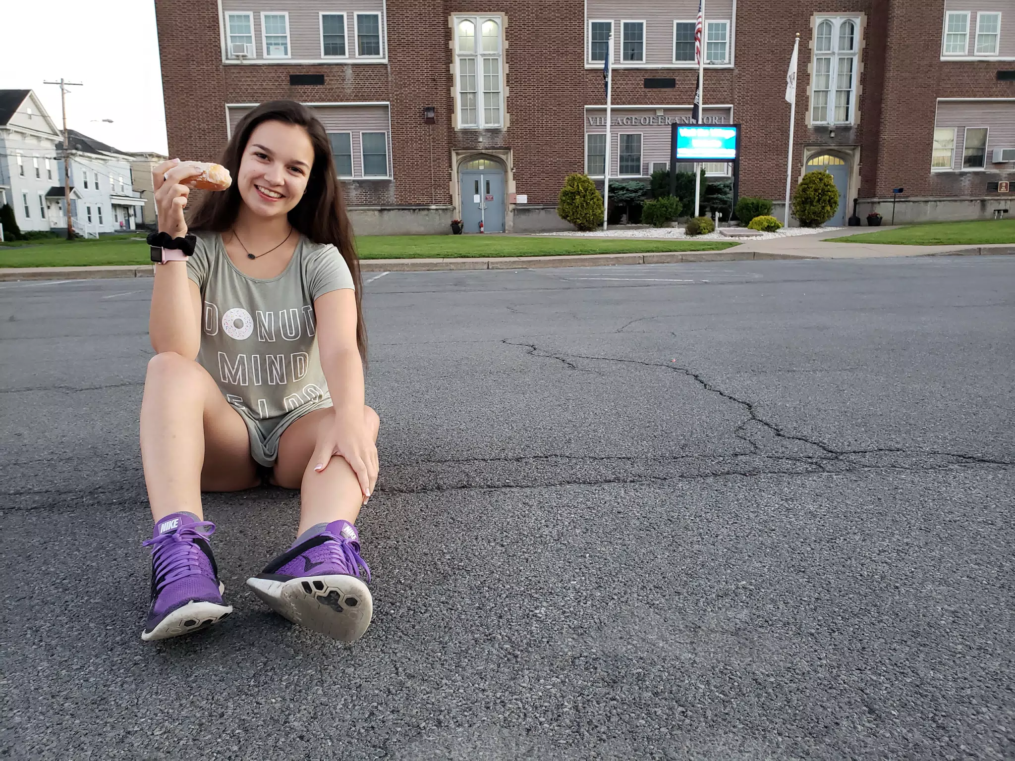 Emily Sitting in Front of the Police Station with a Donut