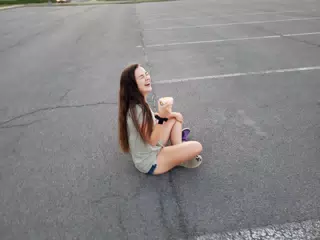 Emily Laughing with Donut on Ground