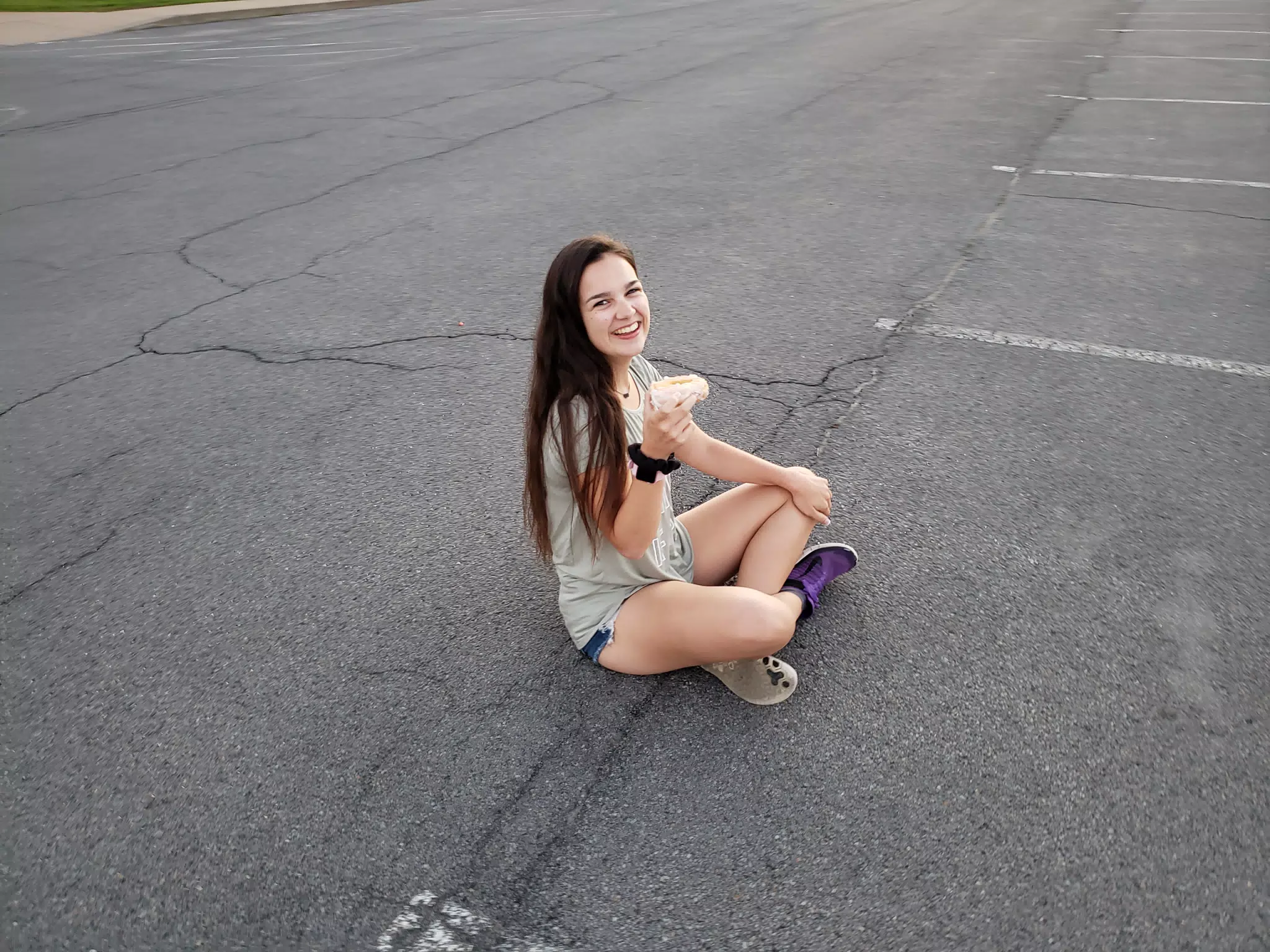 Emily Sitting on Ground with Donut