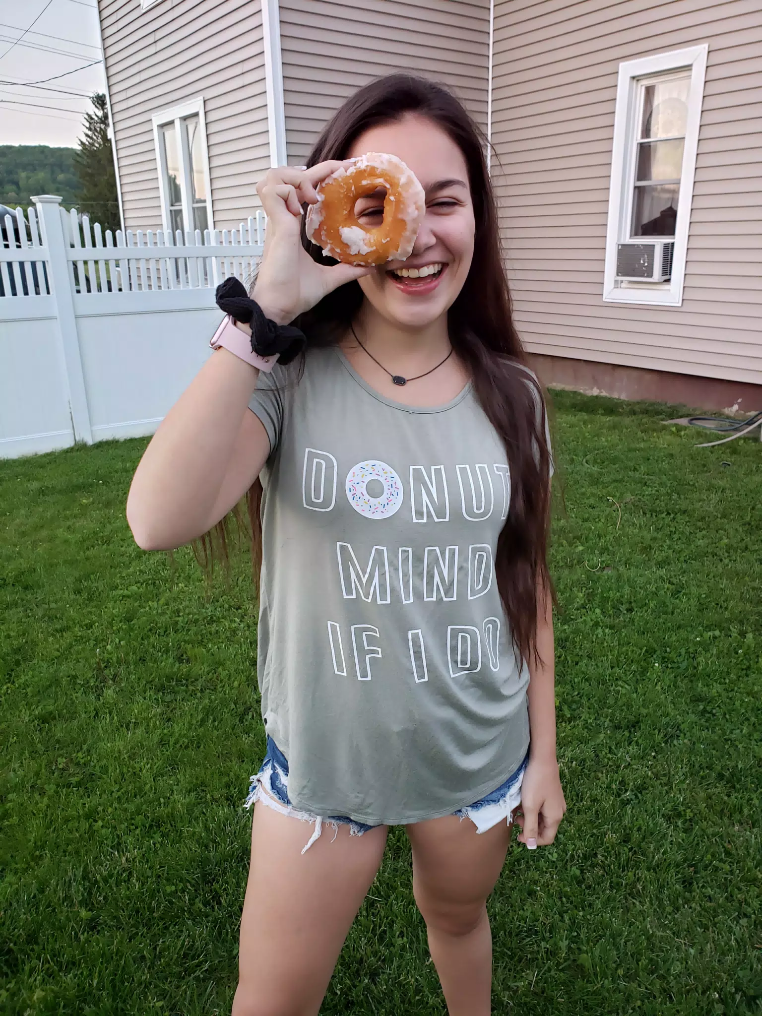 Girl in Backyard with Donut