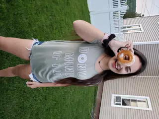 Girl in Backyard with Donut