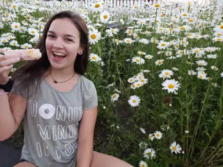 Girl with Donut in Flowers