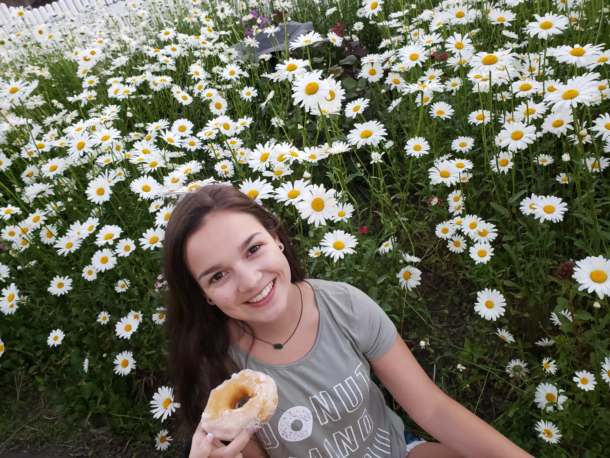 Girl with Doughnut in Daisies