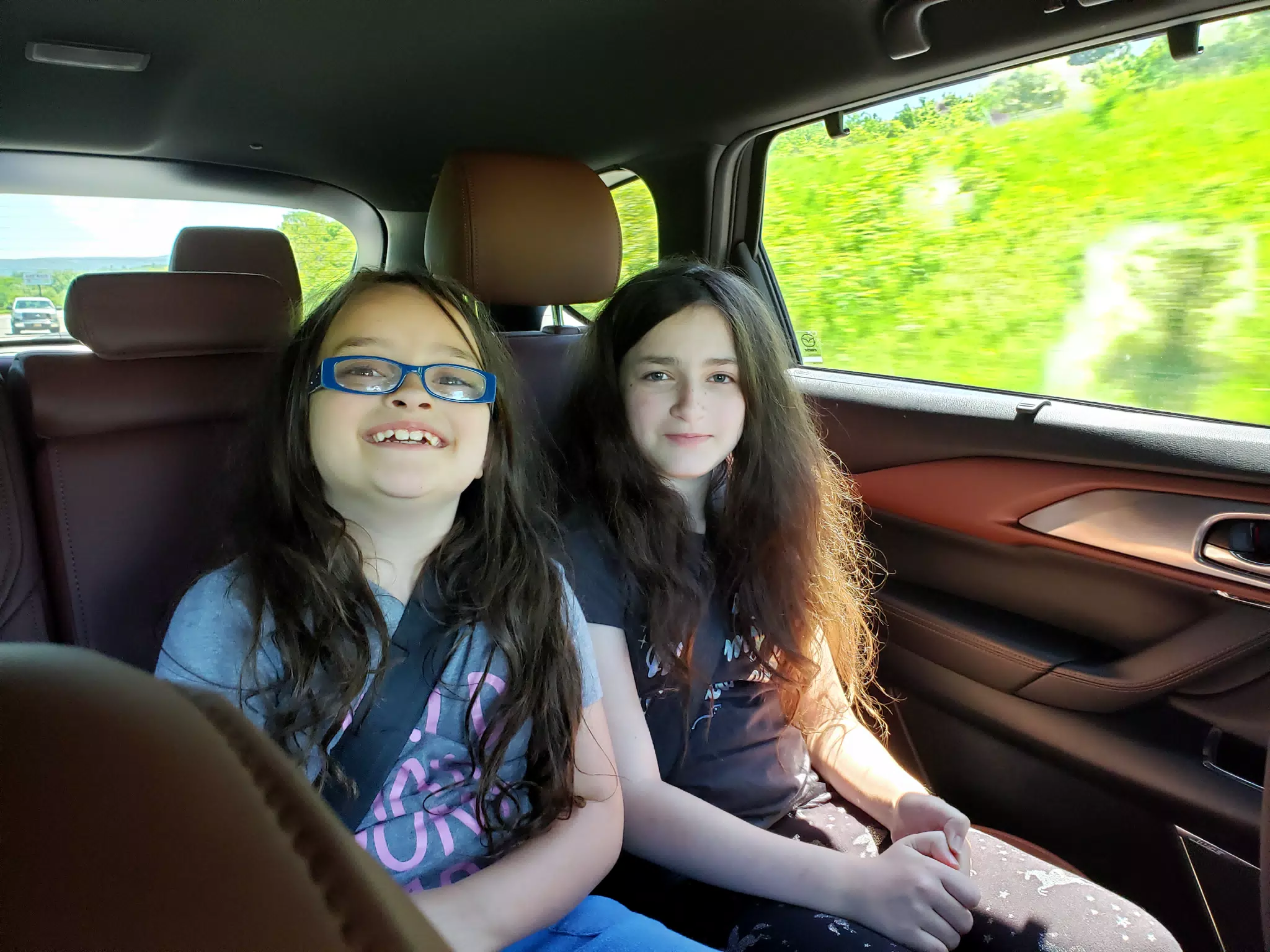 Luciana and Liesl Riding in the Mazda CX9 to the Masonic Home in Utica