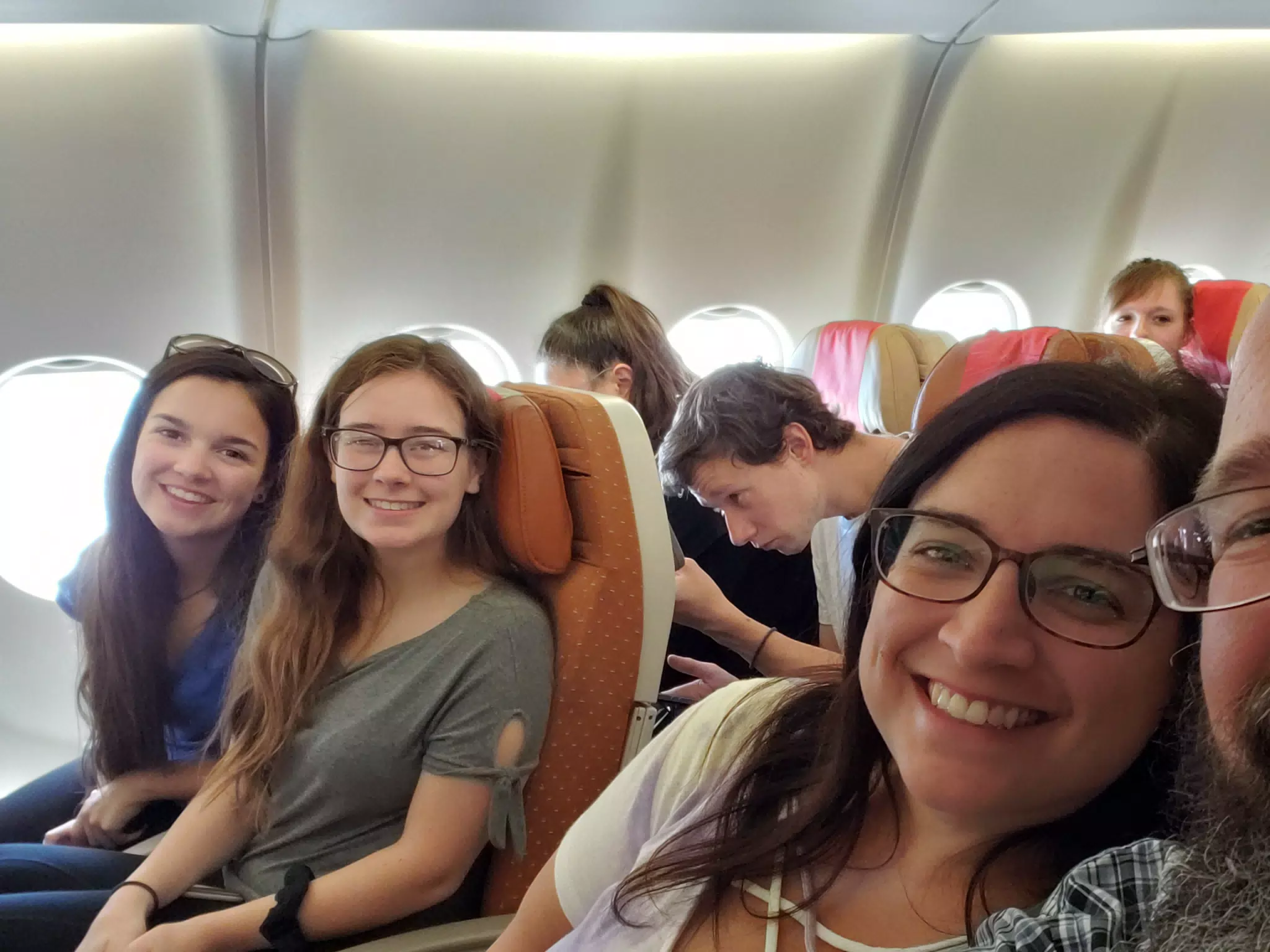 Emily, Madeline, Dominica on Flight from JFK to London