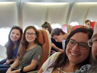 Emily, Madeline, Dominica on Flight from JFK to London
