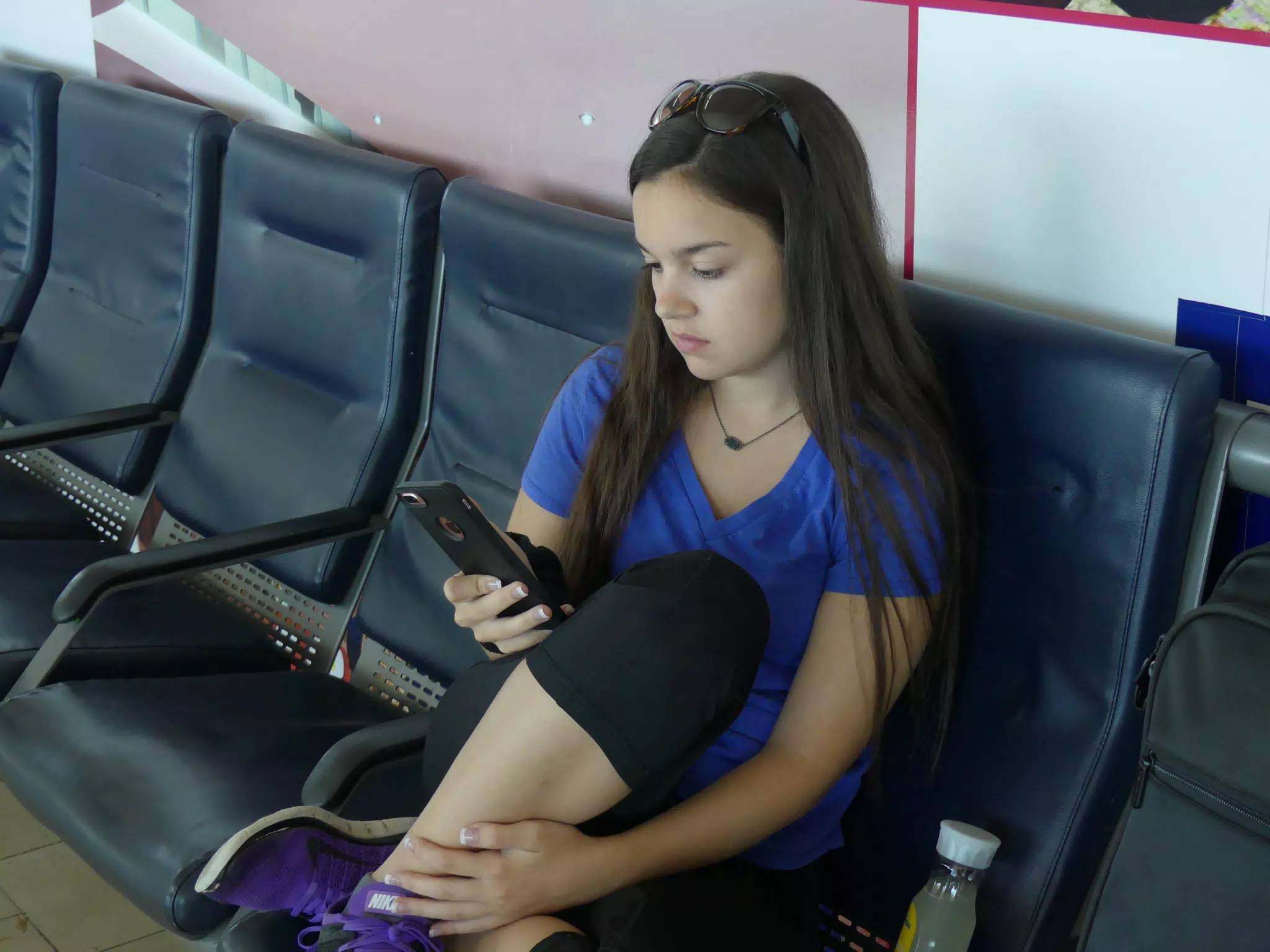 Emily on Her Phone at JFK