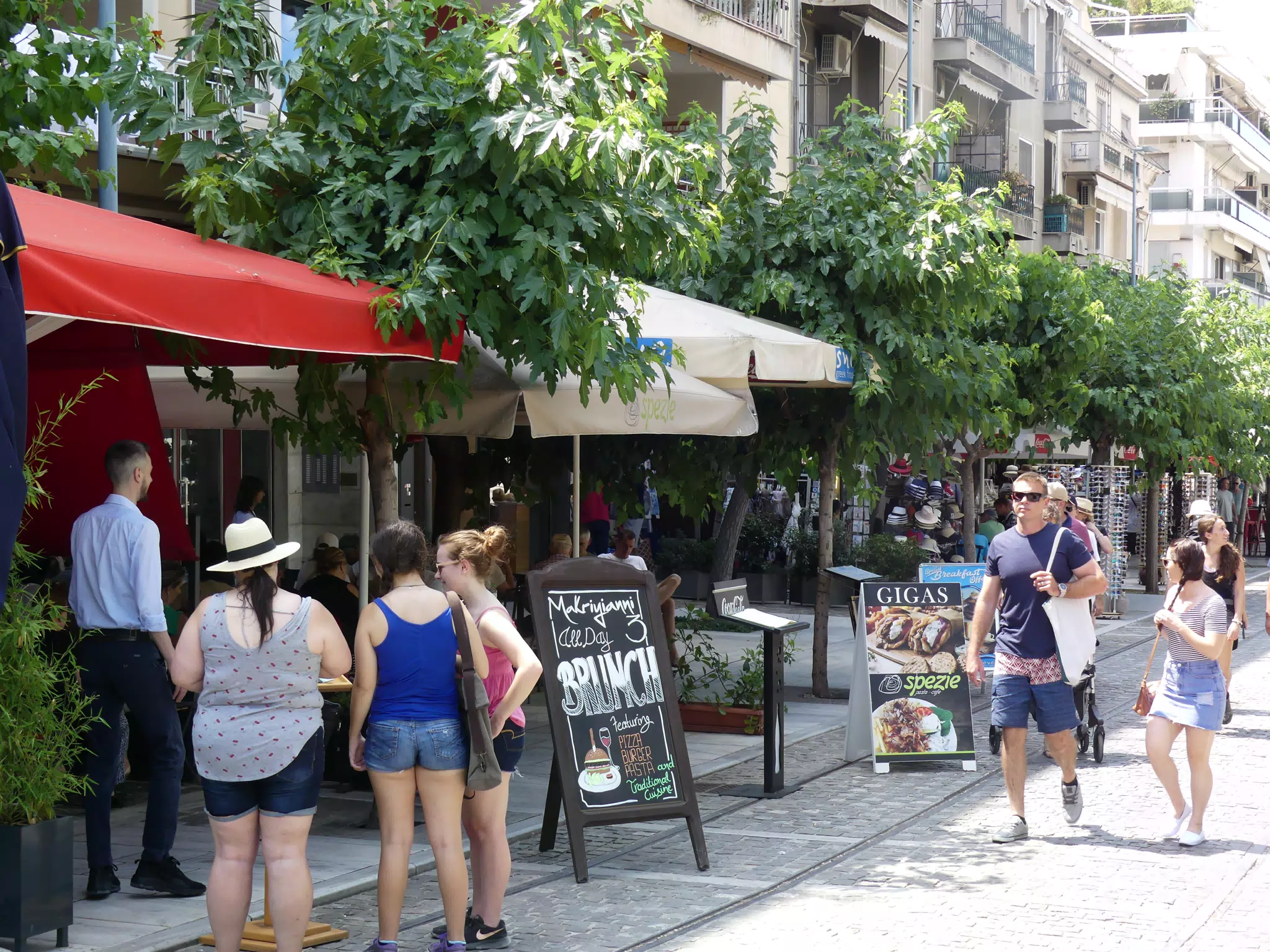 Girls Looking at Menus in Athens
