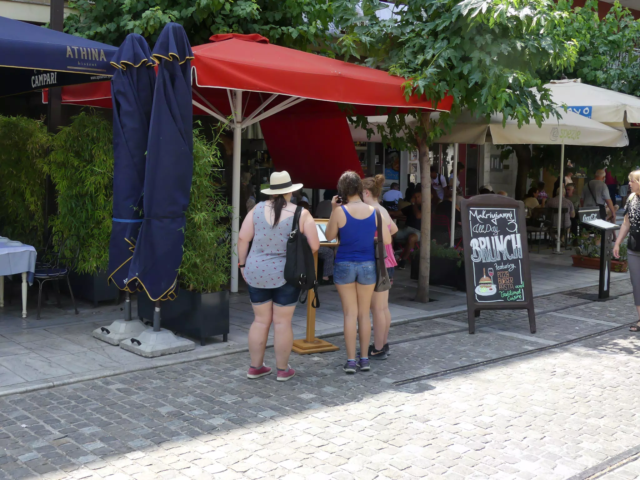 Girls Looking at Menus on Athens Street