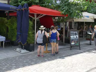 Girls Looking at Menus on Athens Street