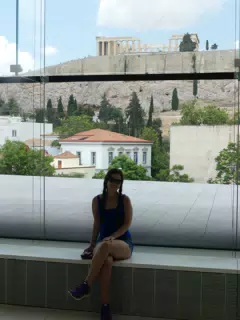 Girl with Parthenon in Museum Windows
