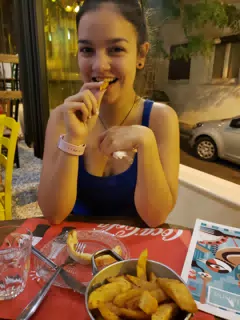 Emily Eating Fries in Athens