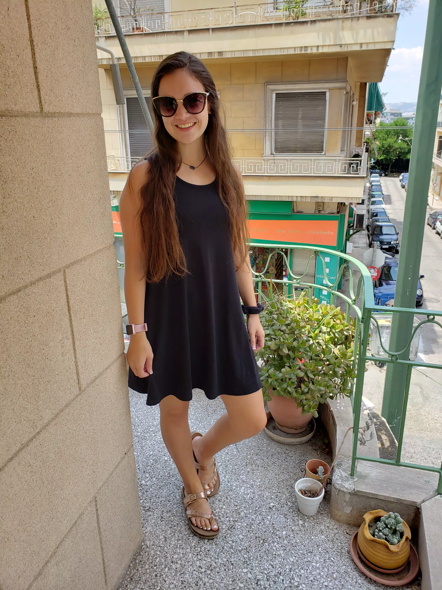 Girl in Black Dress on Balcony in Athens