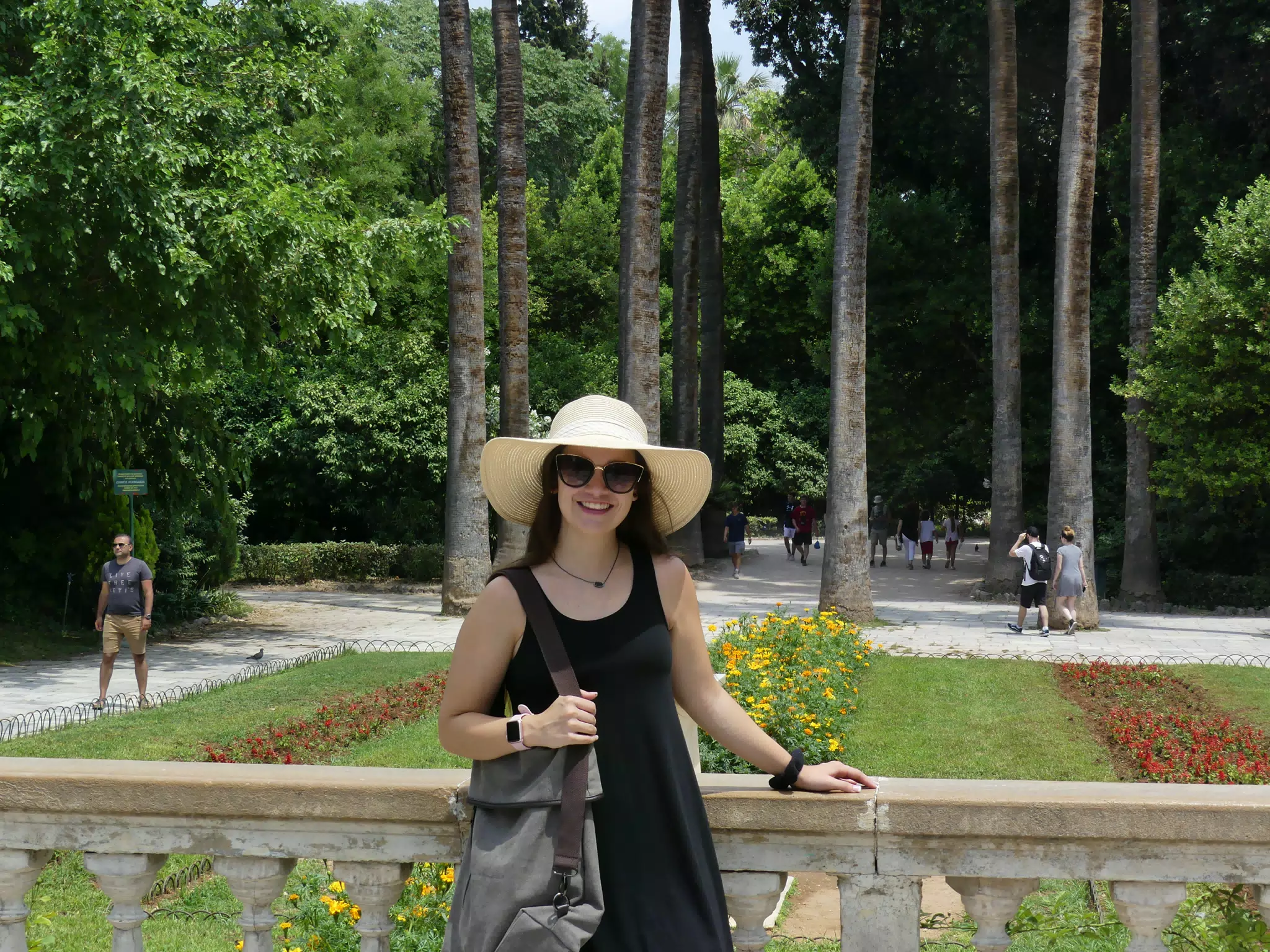 Girl in Black Dress in Park with Hat