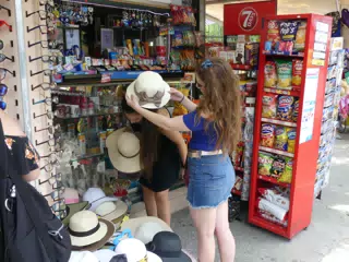 Girls Trying on Hats in Athens