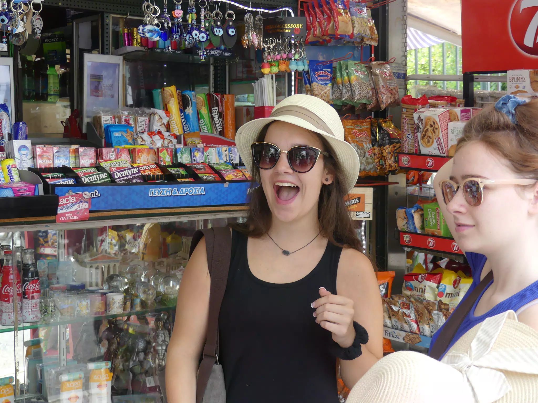 Emily and Madeline Hat Shopping in Greece