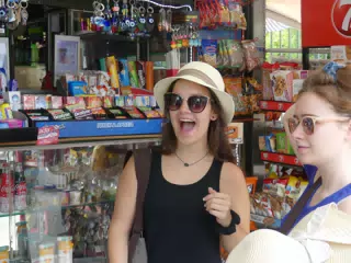 Emily and Madeline Hat Shopping in Greece