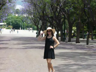 Girl in Hat and Black Dress in National Garden in Athens