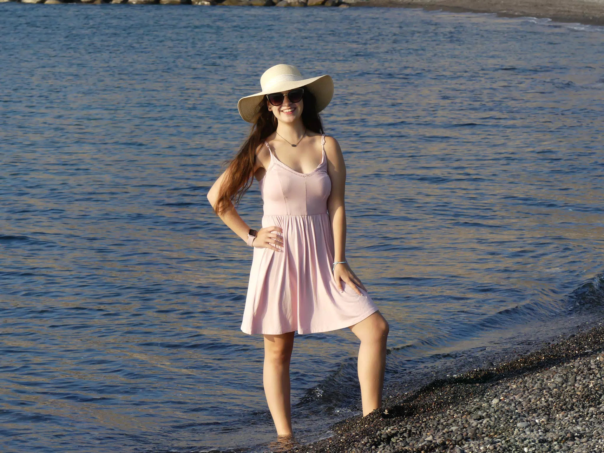 Girl in Hat on Beach on Santorini