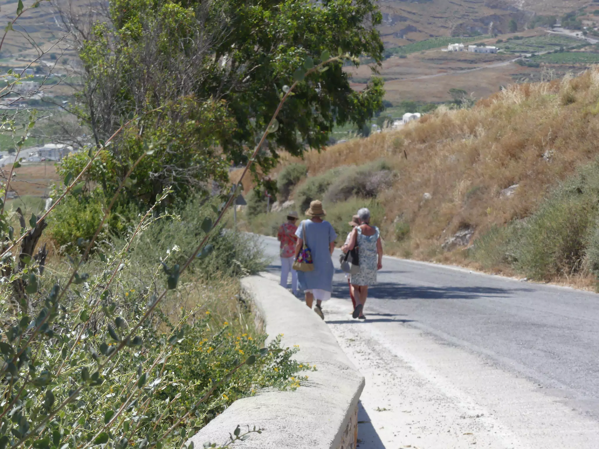 Women Walking on Hill in Central Santorini