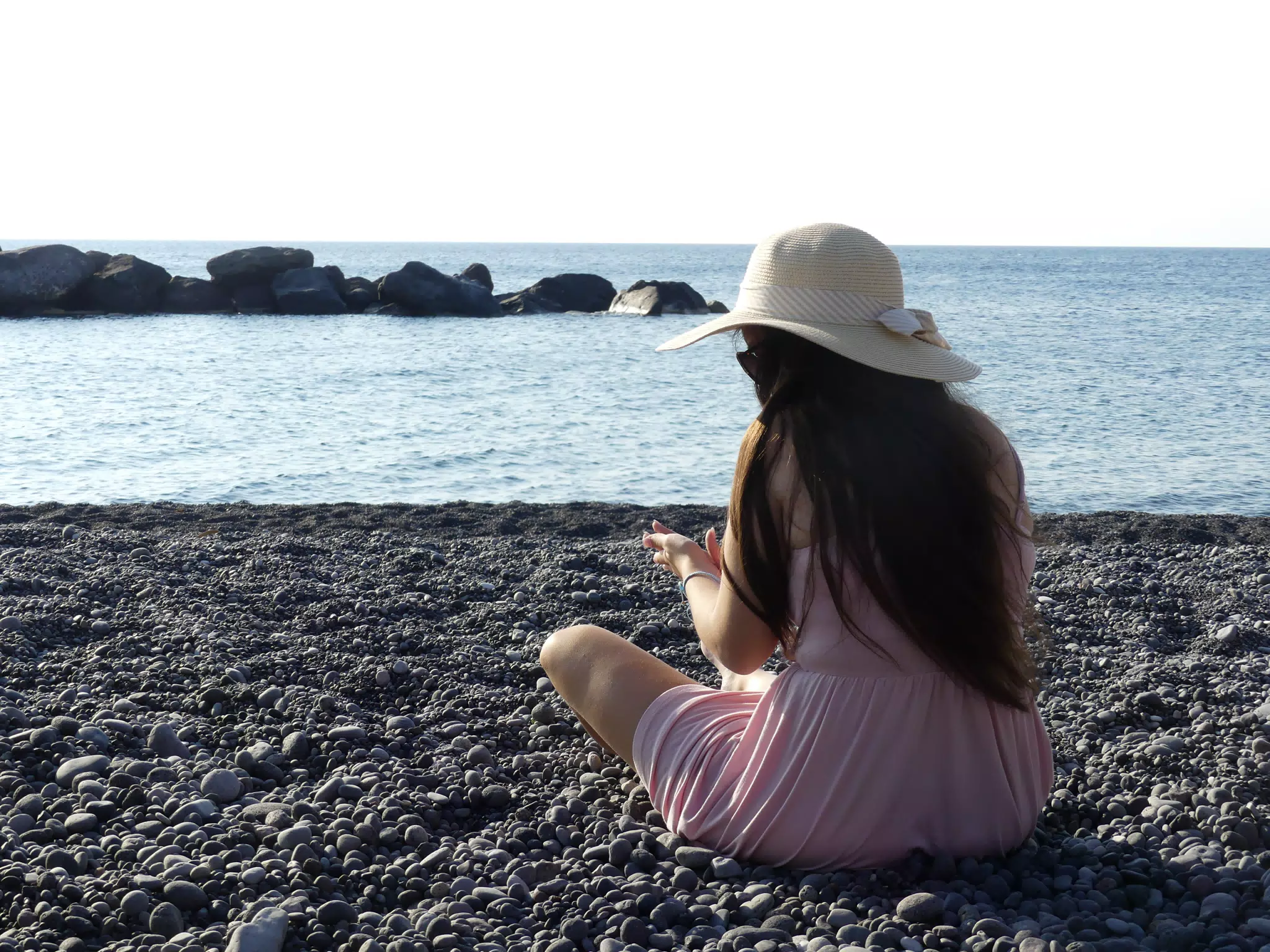 Girl Sitting on Beach