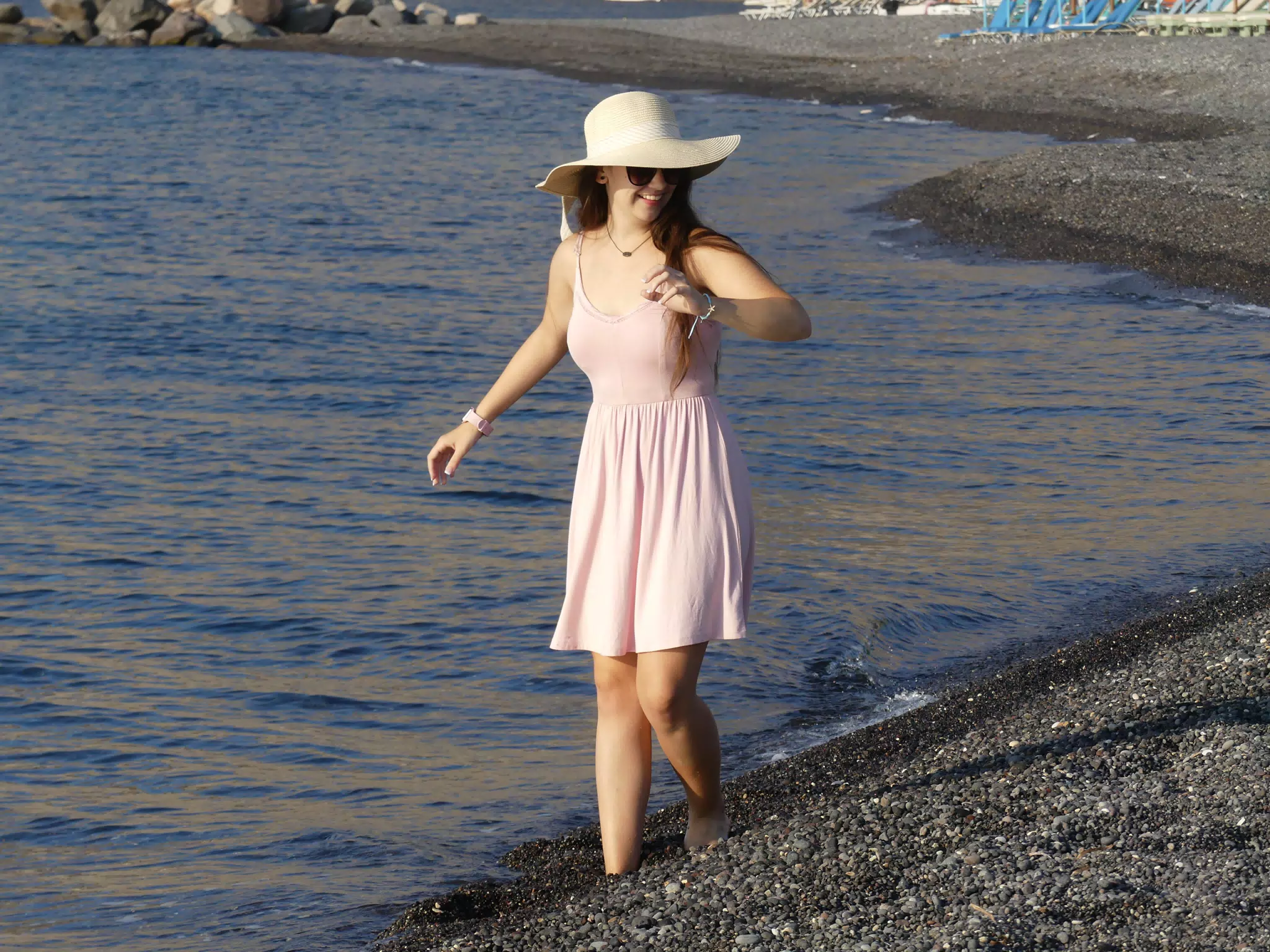 Emily Sinking on the Stone Beach at Kamari