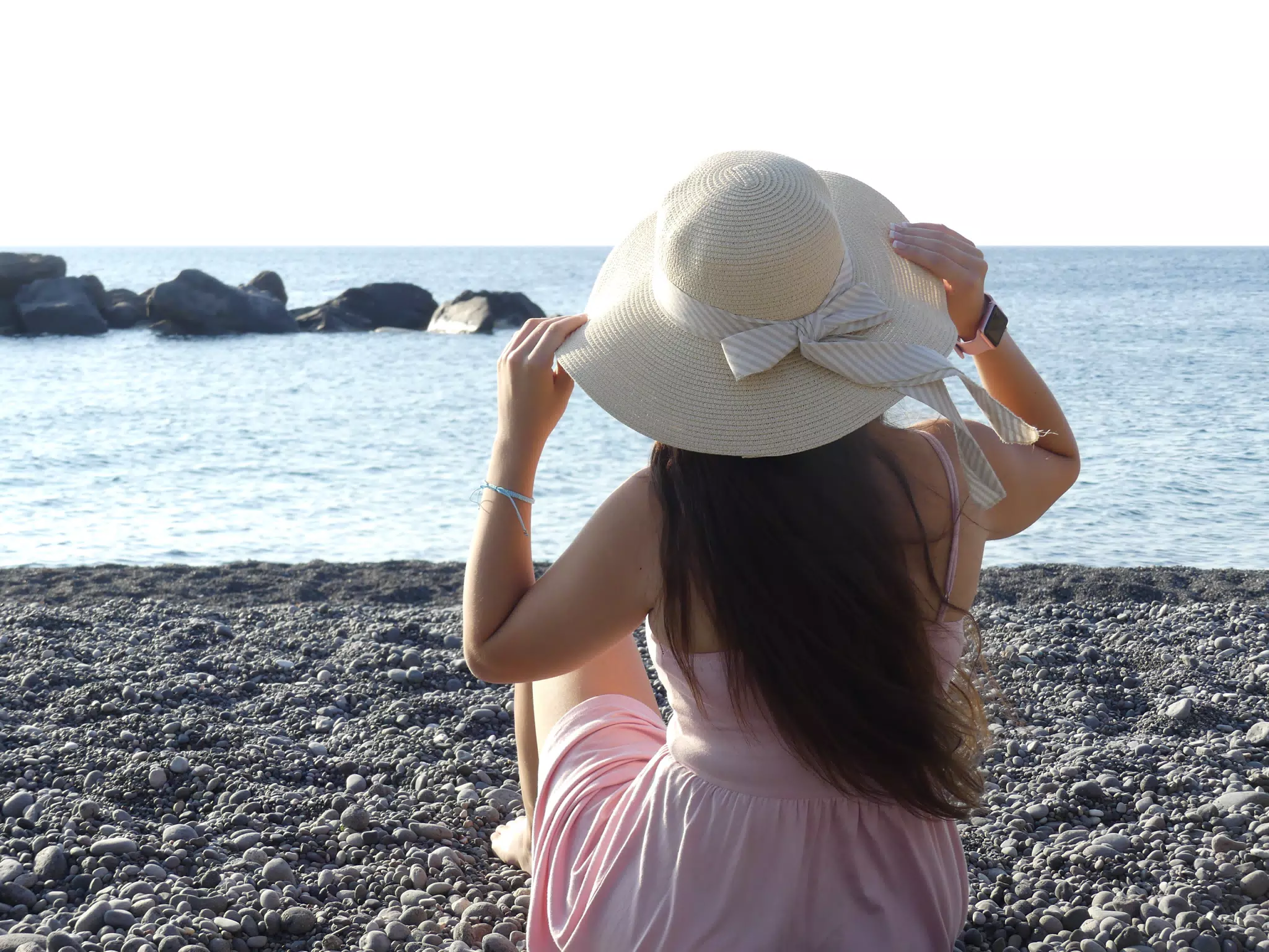 Girl in Hat on Beach Kamari Santorini