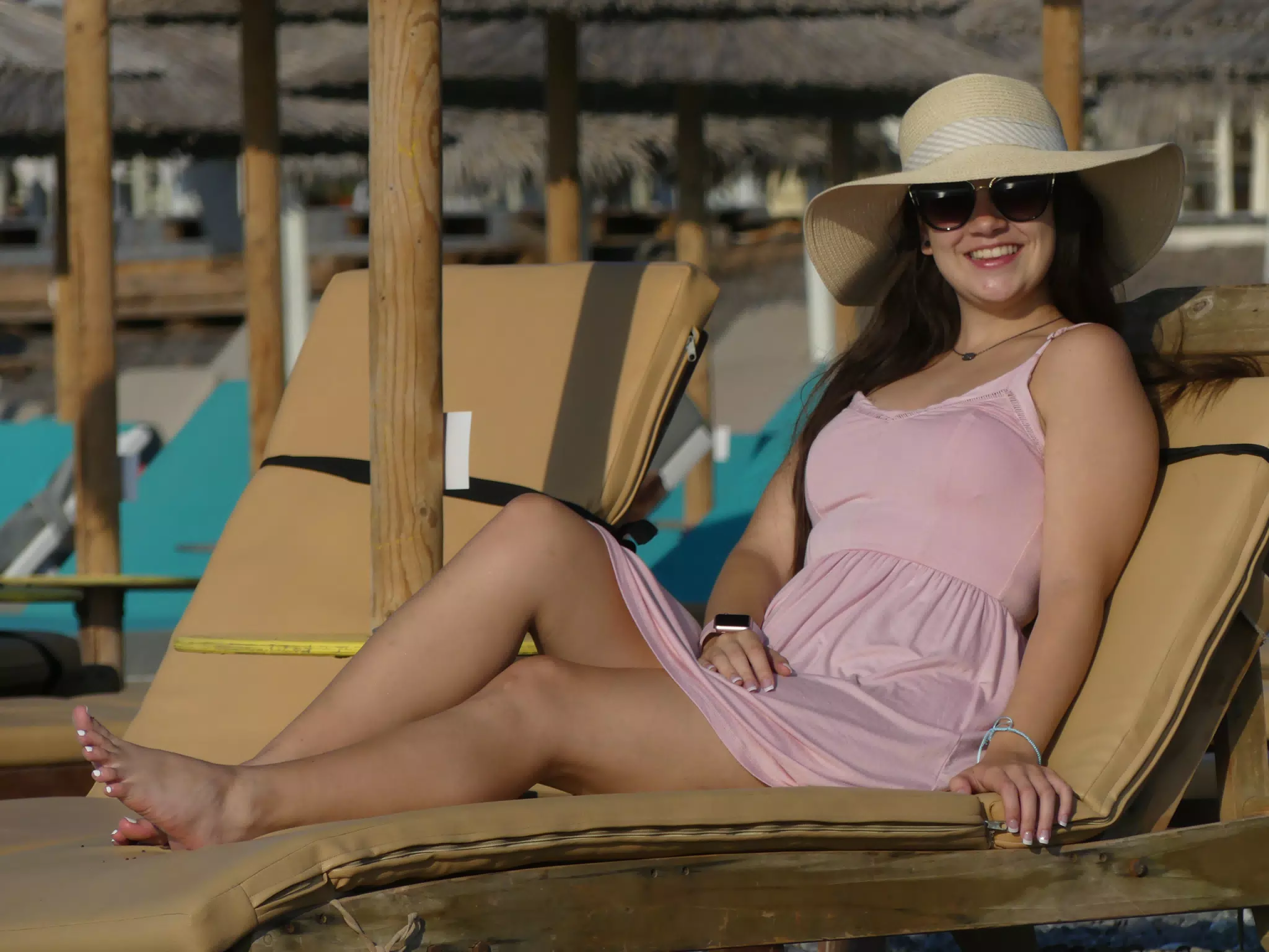 Emily in Sundress on Beach with Hat and Sunglasses