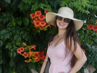 Girl with Red Flowers on Santorini