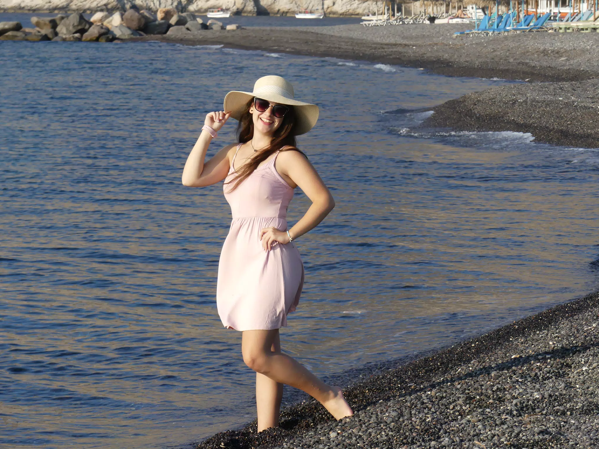 Girl in Pink Dress on Beach on Santorini