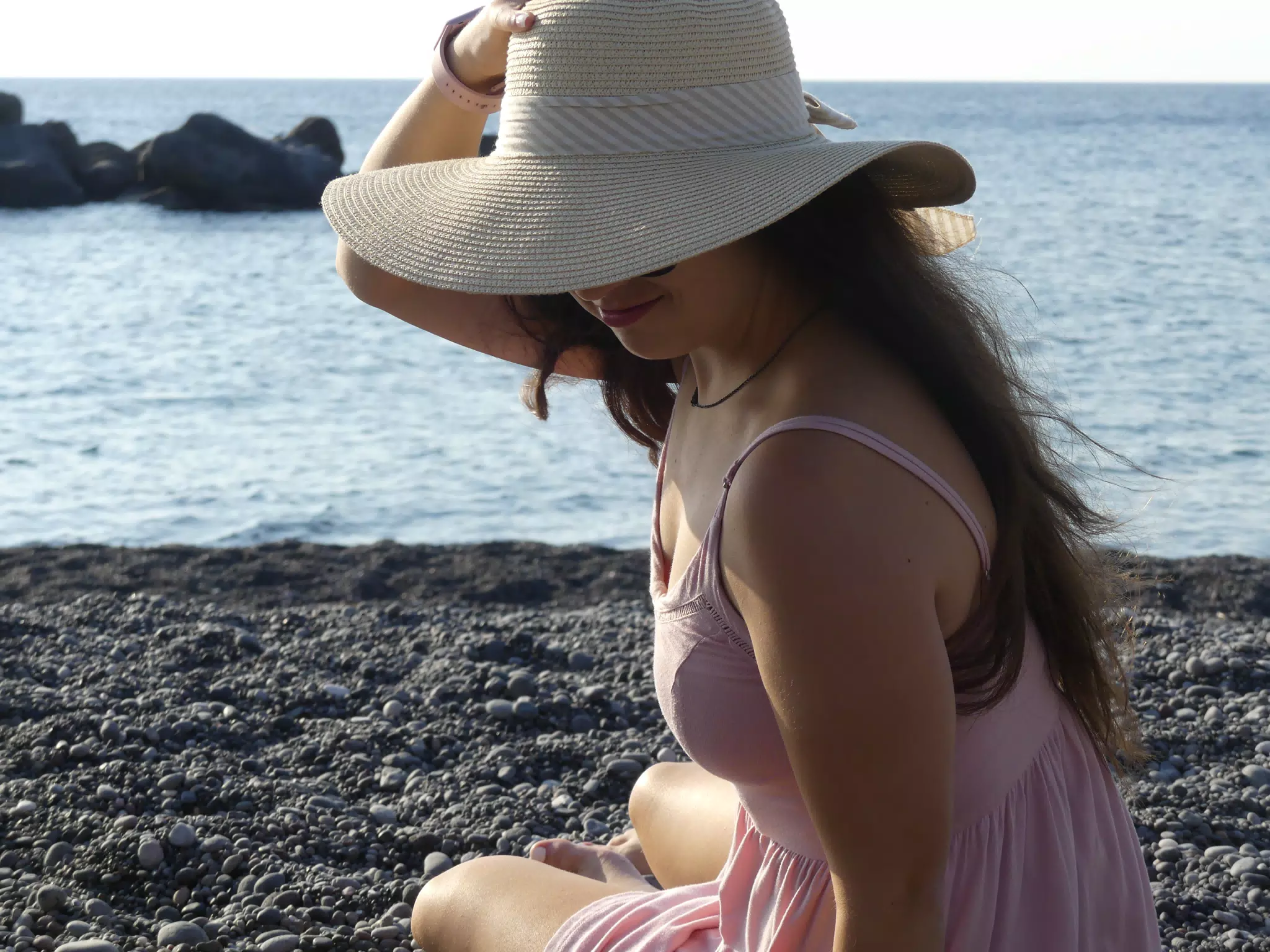 Girl in Hat on Beach on Santorini