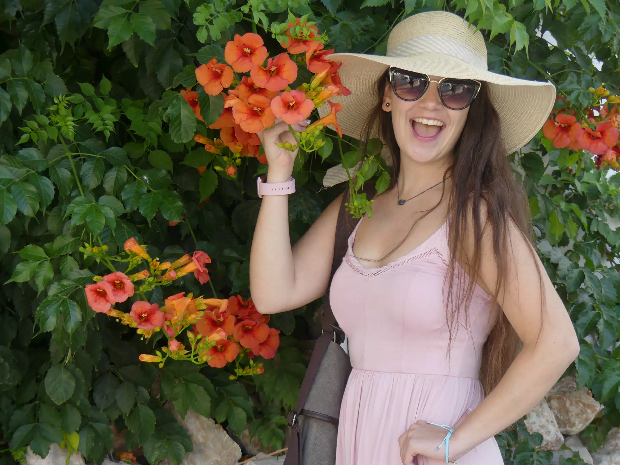 Girl with Hat and Flowers on Santorini