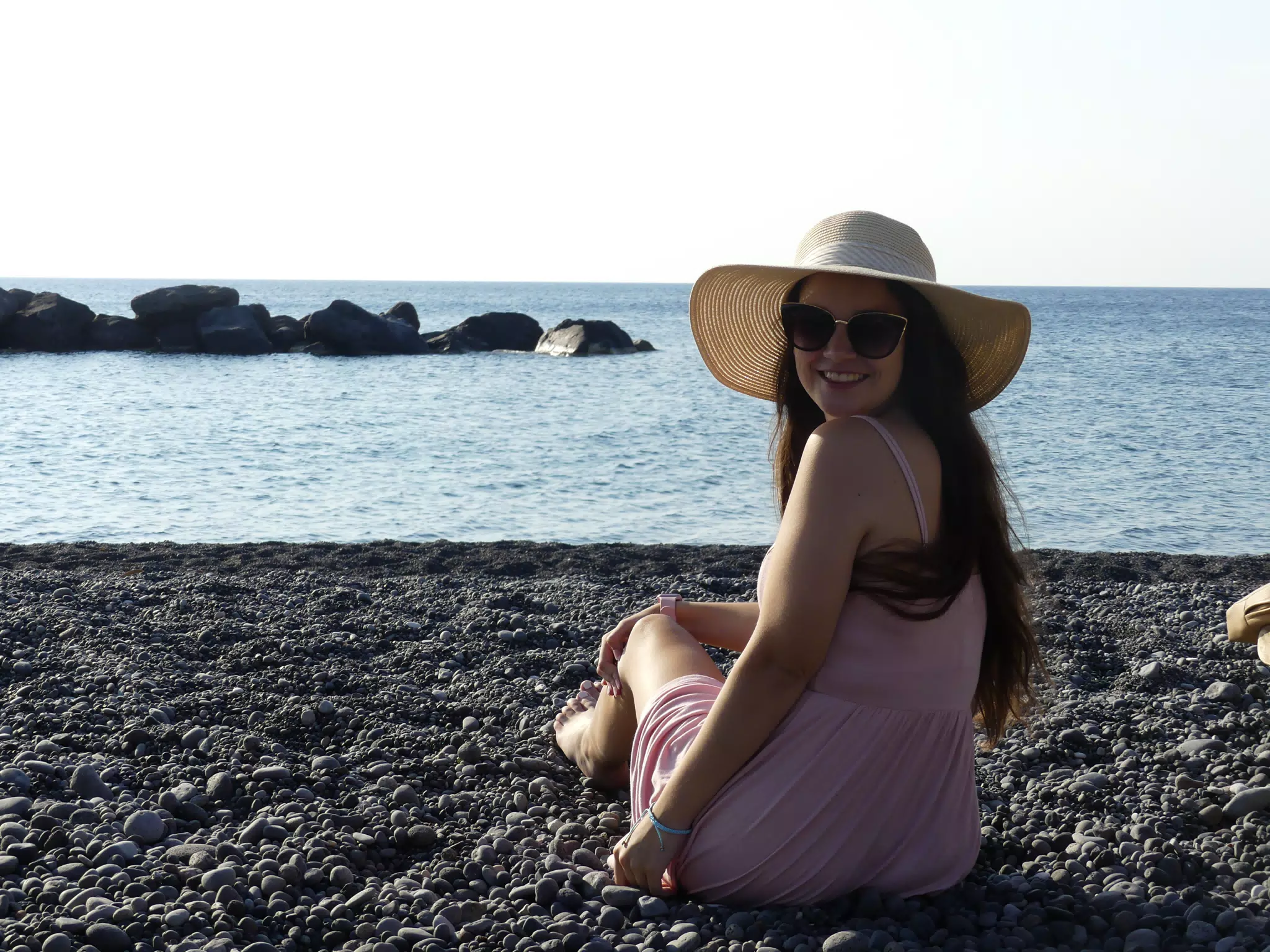 Emily Sitting on the Beach in Santorini
