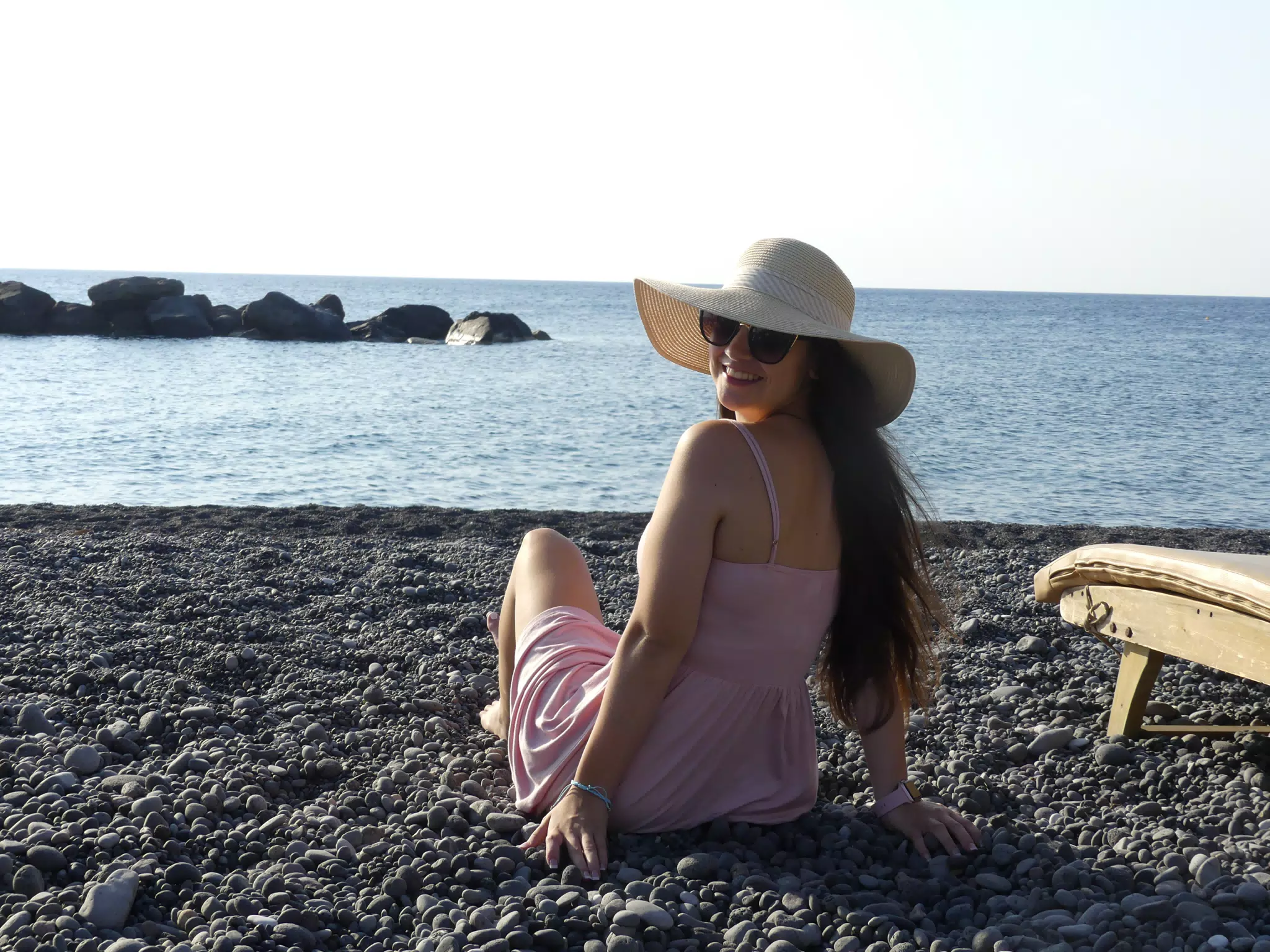 Girl Looking Back on Santorini Beach