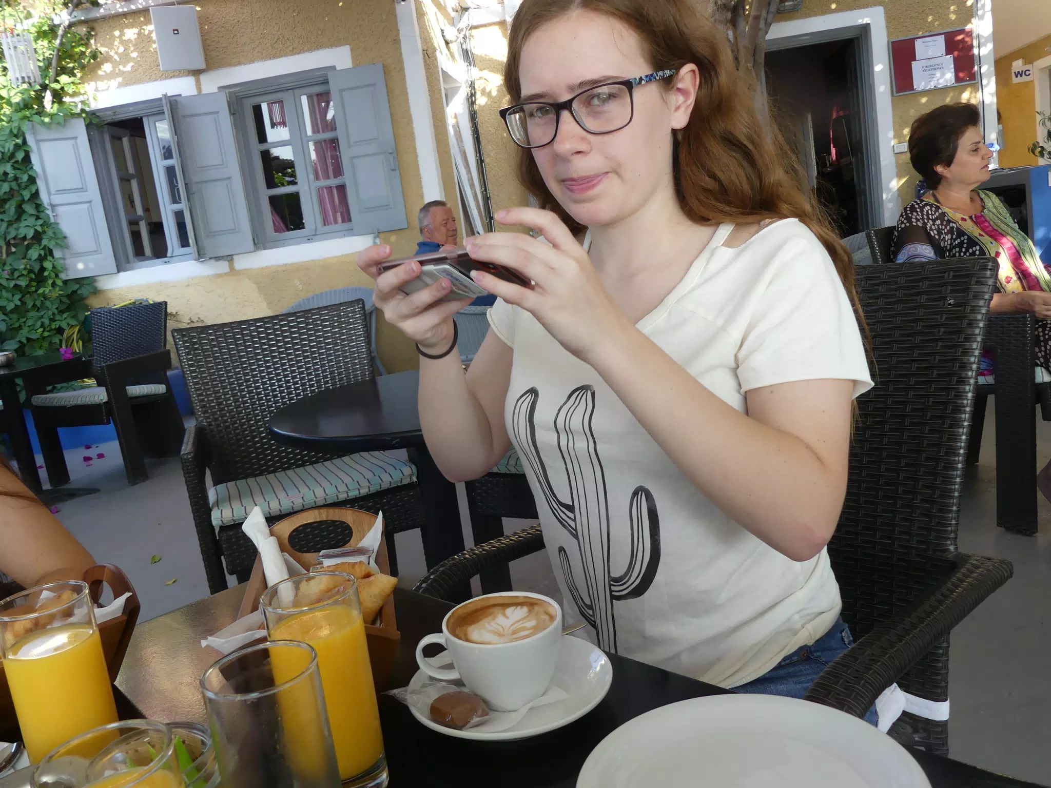 Madeline Instagramming Breakfast in Kamari