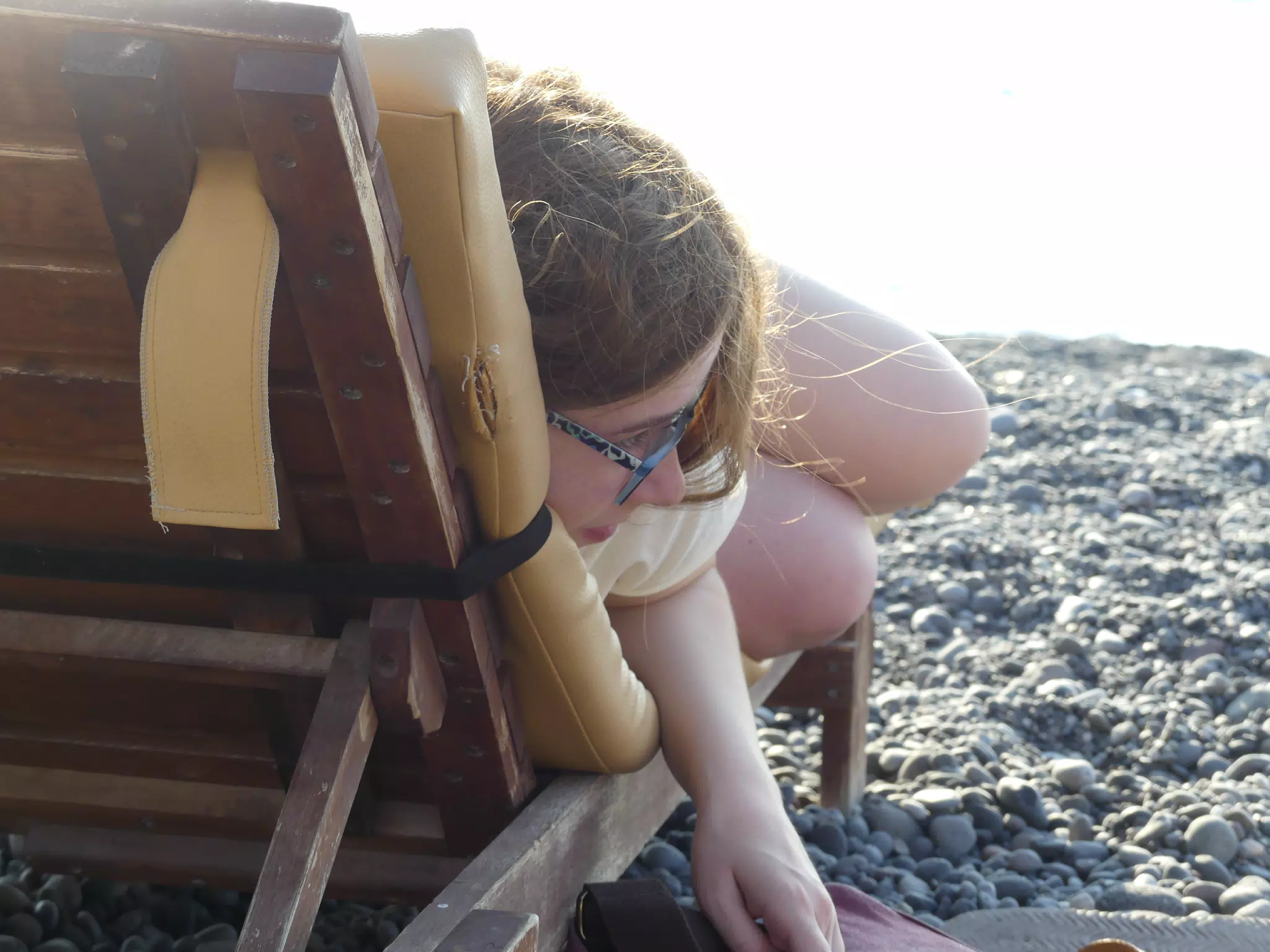 Madeline Reading on the Beach at Kamari