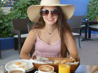 Girl at Breakfast in Kamari Santorini Greece