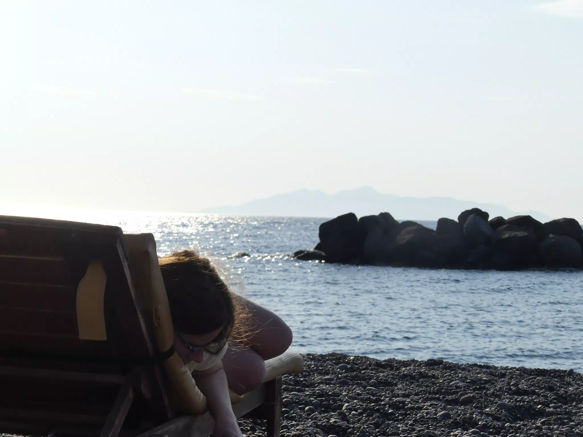 Madeline Reading on the Beach in Kamari