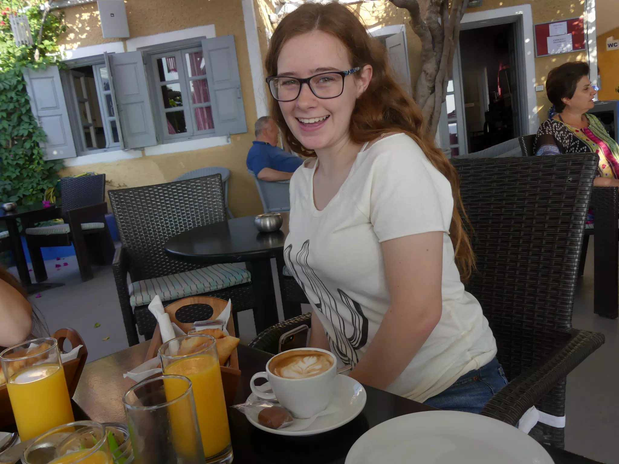 Madeline Having Coffee in Kamari, Santorini