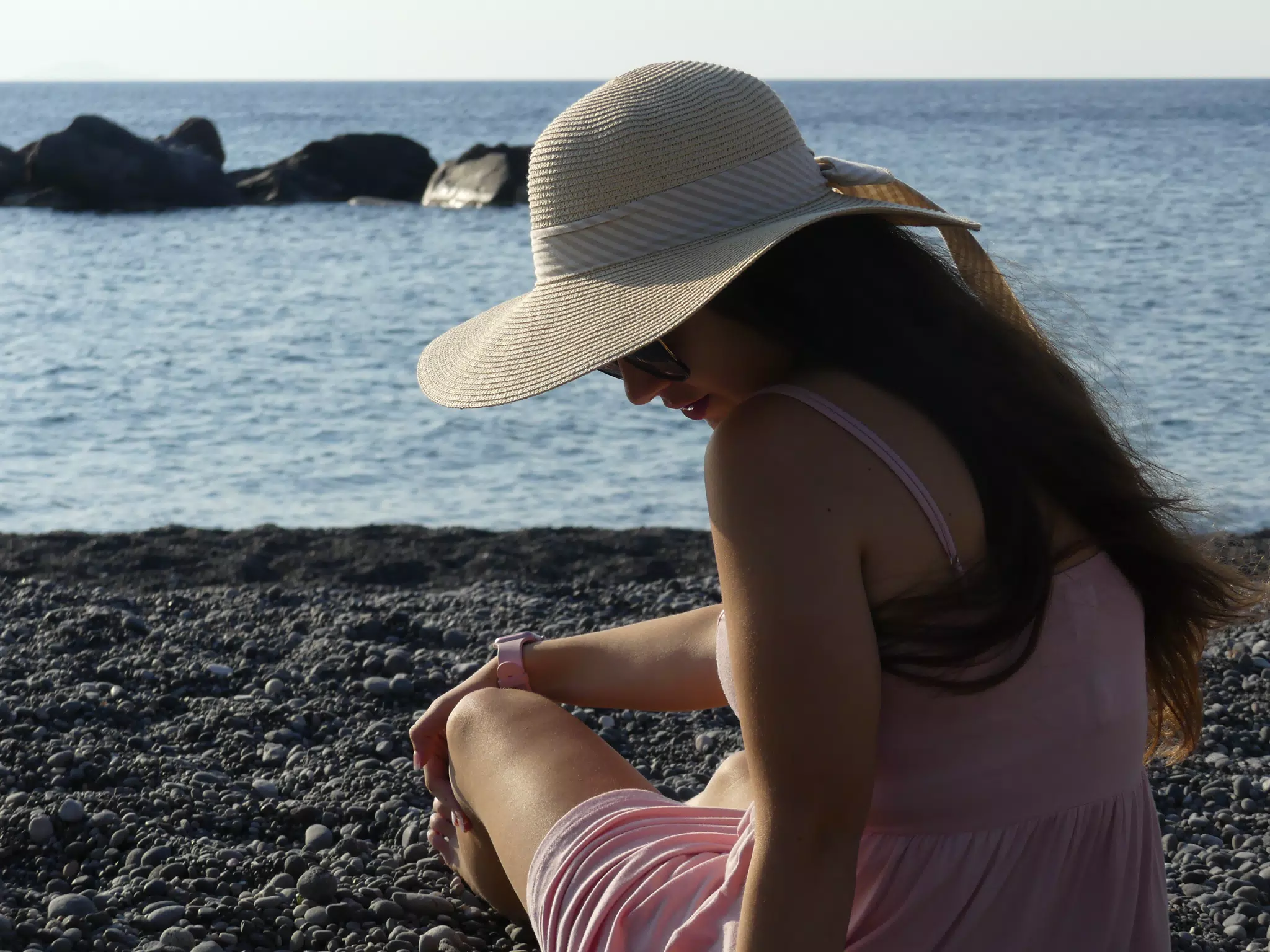 Emily Sitting on Beach at Kamari